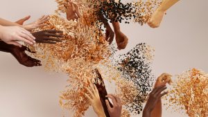 Abstract digital artwork of diverse human hands reaching toward each other, symbolizing unity, diversity, and connection
